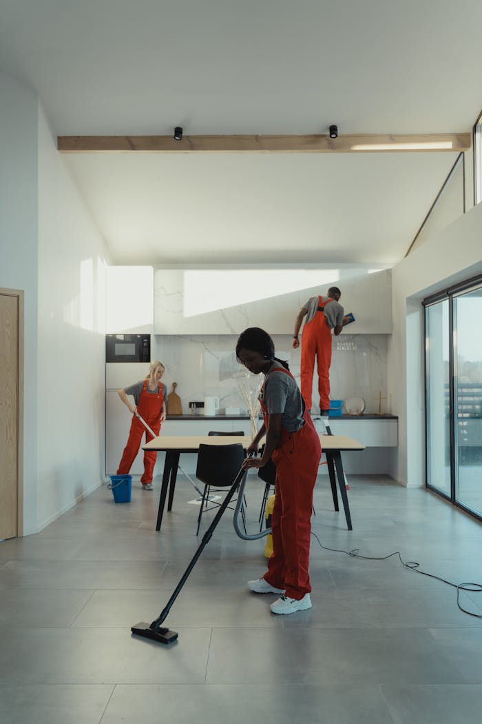 The Art of Drawing Readers In: Your attractive post title goes here A diverse group of professionals cleaning a modern home interior.